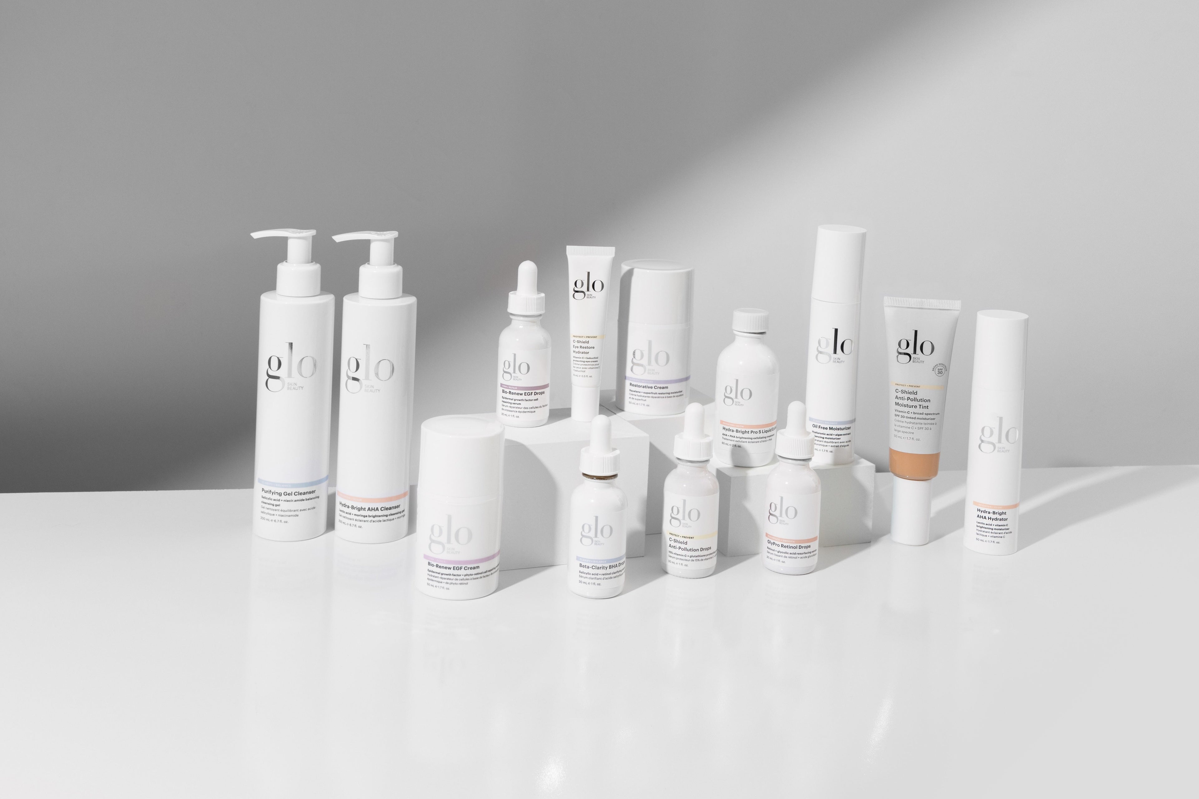 Glo Skin Beauty product lineup on a white surface with a gray background